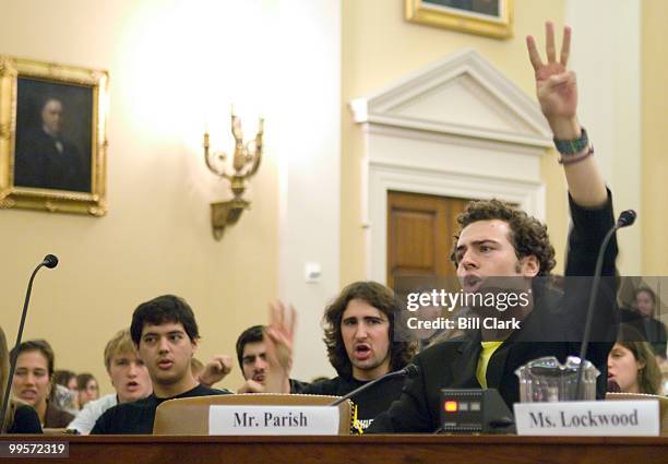 Billy Parish of the Energy Action Coalition leads the audience in environmental chants at the conclusion of his opening statement during the House...