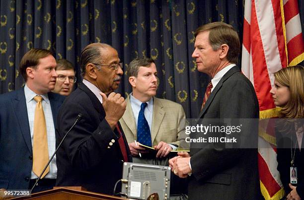 Chairman John Conyers, D-Mich., speaks with Rep. Lamar Smith, R-Texas, as the House Judiciary Committee considers issuing contempt of Congress...