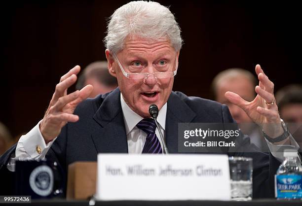 Former President Bill Clinton, chairman of the William J. Clinton Foundation, testifies with Bill Gates, Co-Chair of the Bill and Melinda Gates...