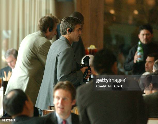 Street Executive Producer George Clooney works on the set at Charlie Palmer Steak restaurant on Capitol Hill before filming a scene for the HBO...