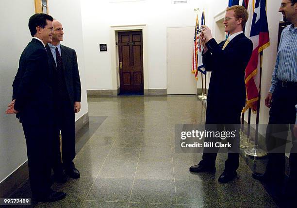 From left, Stephen Colbert and Rep. Adam Smith, D-Wash, pose as Smith's communications director Derrick Crowe takes a photo with chief of staff John...