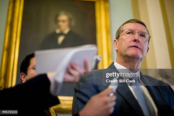 Sen. Kent Conrad, D-N. Dak., stops to speak with reporters as he walks to the weekly Senate Democrats' policy lunch on Tuesday, March 23, 2010.