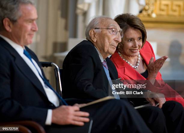From left, President George Bush, Dr. Michael DeBakey and Speaker of the House Nancy Pelosi, D-Calif., attend ceremony to present the Congressional...