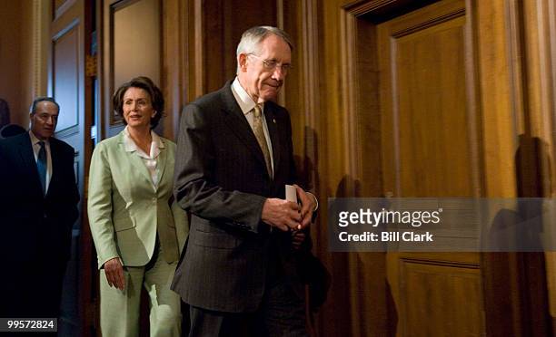 From left, Sen. Chuck Schumer, D-N.Y., Speaker of the House Nancy Pelosi, D-Calif., and Senate Majority Leader Harry Reid, D-Nev., arrive for the...