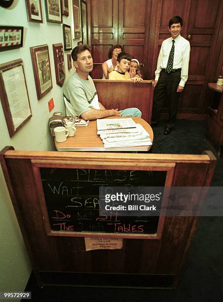 Rep. Dennis Kucinich speaks with constituents in his new diner/lobby Tuesday morning August 8, 2000. The visitors from Lakewood, Ohio are Alan and...