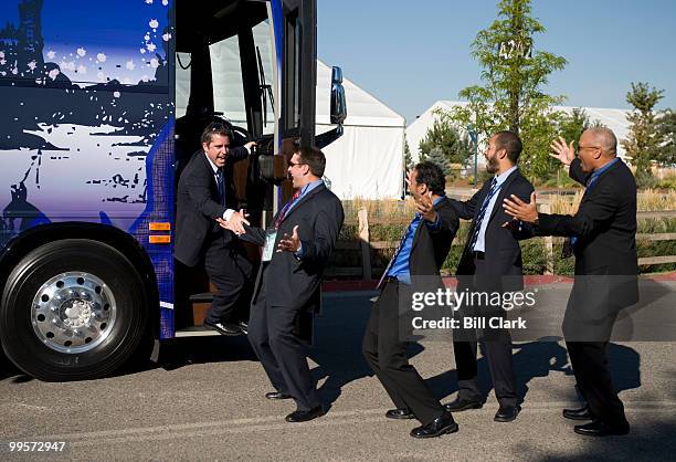 Daily Show correspondents film a spot with the Daily Show bus outside of the Pepsi Center on the first day of the Democratic National Convention in...