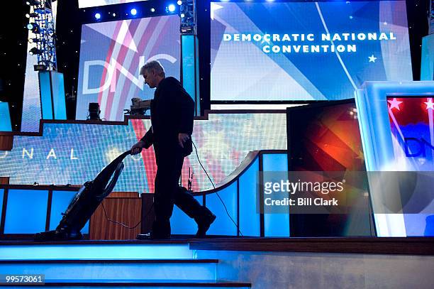 Stage hand vacuums the stage before the start of day 2 at the 2008 Democratic National Convention at the Pepsi Center in Denver, Colo., on Aug. 26,...