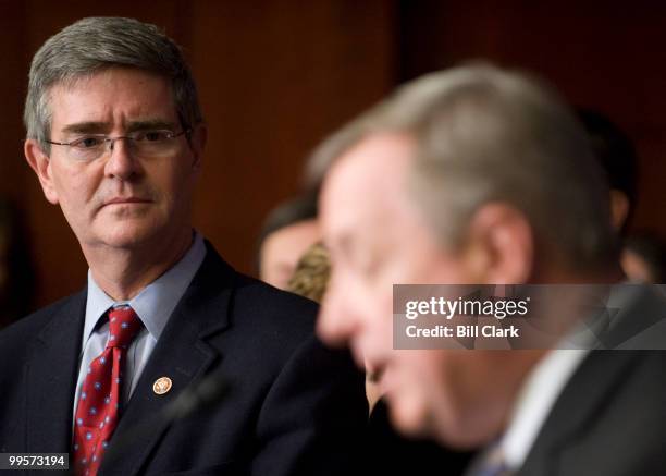 Rep. Brad Miller, D-N.C., left, listens as Sen. Richard Durbin, D-Ill., during their news conference in the Capitol Visitors Center on the...