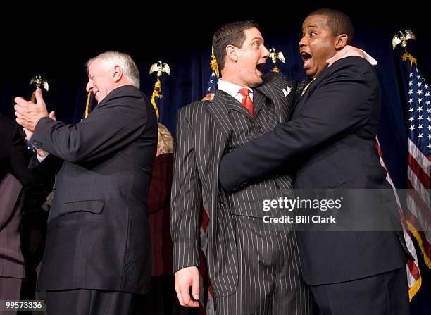 From left, Rep. Steny Hoyer, D-Md., claps as Rep. Tim Ryan, D-Ohio, and Rep. Kendrick Meek, D-Fla., hug at the DSCC and DCCC Election Night Watch...