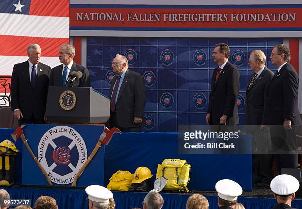 From left, House Majority Leader Steny Hoyer, D-Md., President George Bush, Hal Bruno, chairman of the board National Fallen Firefighters Foundation,...
