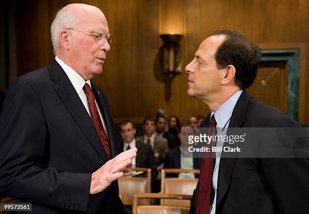 Sen. Patrick Leahy, D-Vt., speaks with Justice Department Inspector General Glenn Fine before the start of the Senate Judicary Committee hearing on...