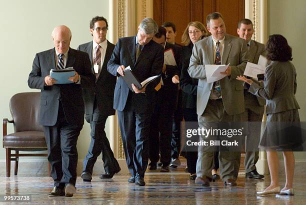 From left, Ben Cardin, D-Md., Sheldon Whitehouse, D-R.I., and John Tester, D-Mont., lead a procession of freshman Democratic Senators and staffers...