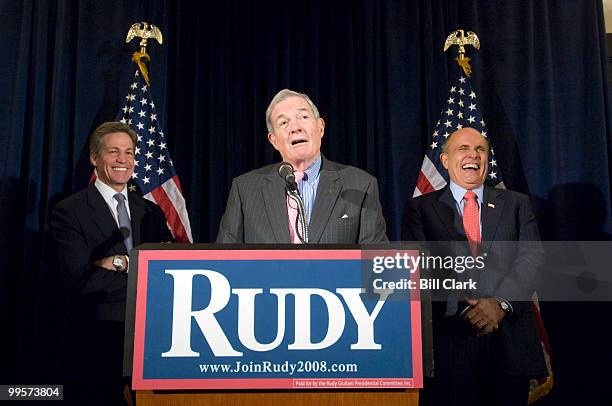 From left, Sen. Norm Coleman, R-Minn., listens as Sen. Kit Bond, R-Mo., endorses Republican Presidential candidate Rudy Giuliani at the Phoenix Park...