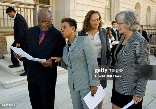 From left, Rep. Danny Davis, D-Ill., Rep. Barbara Lee, D-Calif., Rep. Laura Richardson, D-Calif., and Rep. Lynn Woolsey, D-Calif., talk after their...