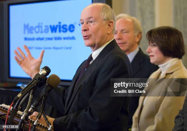 From left, Dr. David Walsh, president and founder of the National Institute on Media and the Family, Sen. Joe Lieberman, I-Conn., and Sen. Amy...