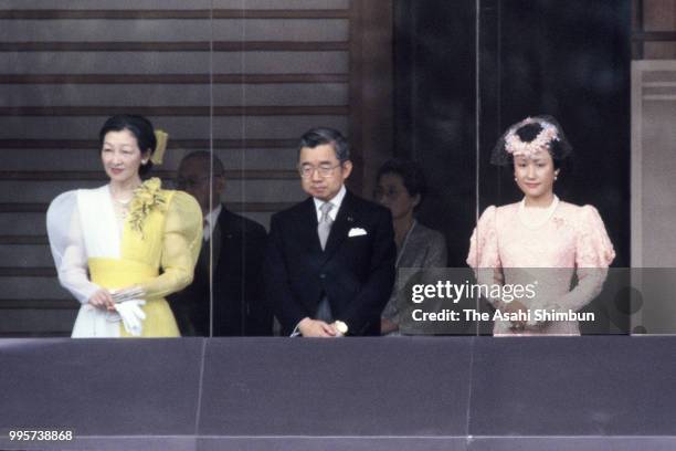 Crown Princess Michiko, Prince Hitachi and Princess Hanako of Hitachi attend the celebration session as Emperor Hirohito turns 85 at the Imperial...