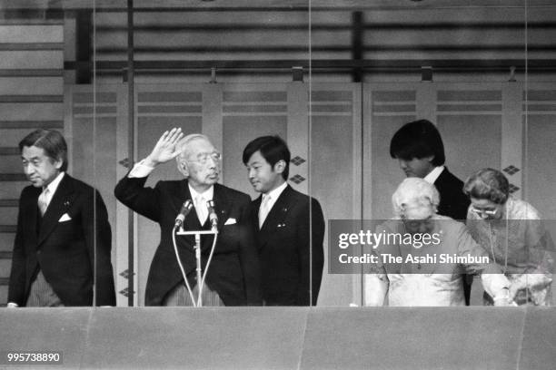 Emperor Hirohito waves to well-wishers with Empress Nagako as he turns 85 at the Imperial Palace on April 29, 1986 in Tokyo, Japan.