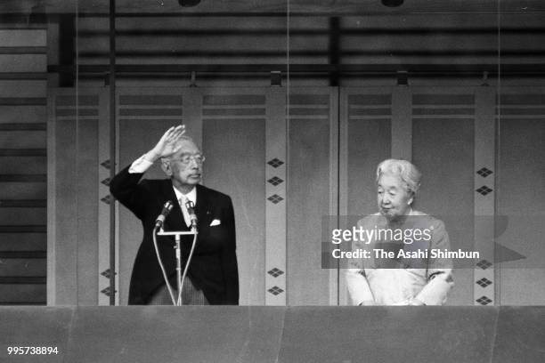 Emperor Hirohito waves to well-wishers with Empress Nagako as he turns 85 at the Imperial Palace on April 29, 1986 in Tokyo, Japan.
