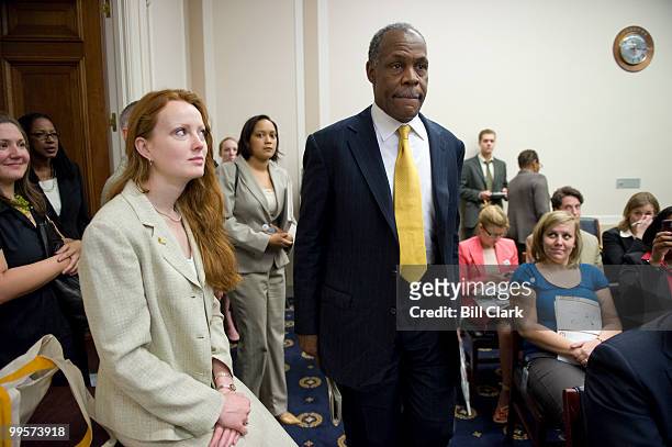 Elizabeth Kucinich, wife of Rep. Dennis Kucinich, D-Ohio, watches as actor Danny Glover arrives for the global food crisis briefing "Why are the...