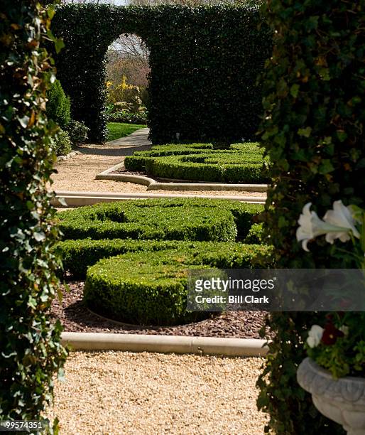An ivy doorwya leads to the French parterre at the Marjorie Merriweather Post mansion at the Hillwood Estate in Washington.