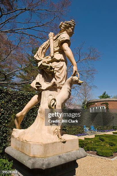 Terra cotta statue of Diana, goddess of the hunt, stands in the French parterre at the Marjorie Merriweather Post mansion at the Hillwood Estate in...