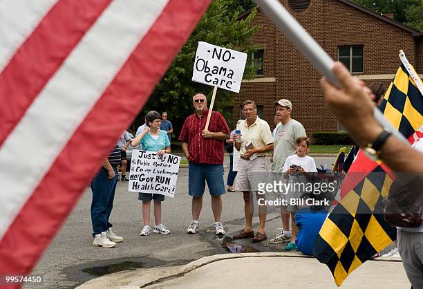 Few of the estimated crowd of 125 listen to speeches against health care reform during the Recess Rally in front of Rep. Hoyer's office in Waldorf,...