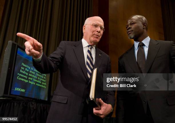 Chairman Patrick Leahy, D-Vt., speaks with actor Djimon Hounsou before the start of the SENATE JUDICIARY COMMITTEE hearing on "Living on the St.:...