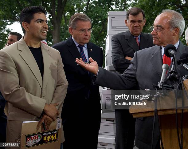 Rep. Joe Baca, D-Calif., right, introduces Univision radio personality Eddie "Piolin" Sotelo during the immigration news conference in Upper Senate...