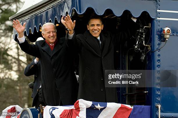 Vice President elect Joe Biden and President elect Barack Obama wave to the crowd gathered at the Edgewood, Md., train station as their train heads...