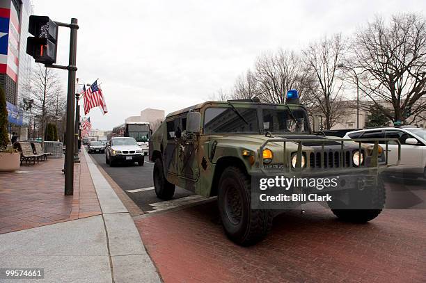 Military police humvee rolls down Pennsylvania Ave. NW along the parade route on Sunday morning, Jan. 18 as preparations continue forBarack Obama's...