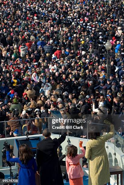 From left, Malia Obama, Barack Obama, Sasha Obama, and Michelle Obama wave to the crowd after Barack was sworn in as the 44th President of the United...