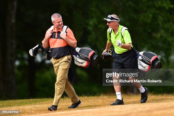 Steven Wilson walks with Amateur Steven Jones of Mold Golf Club during the Lombard Trophy North of England Qualifier at Sandiway Golf Club on July...