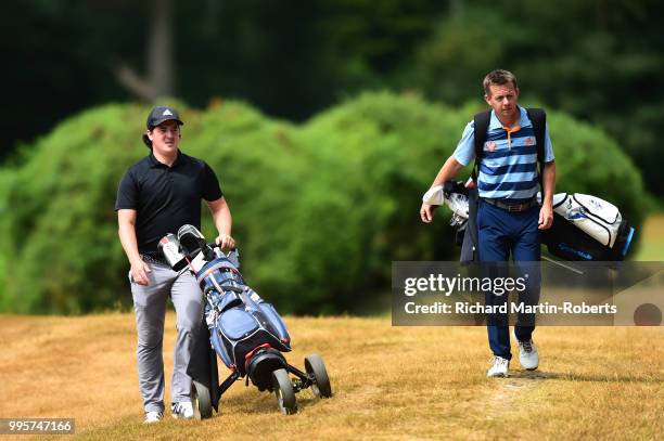 Amateur Andrew Barton and John Fisher of Huyton & Prescot Golf Club walk together during the Lombard Trophy North of England Qualifier at Sandiway...