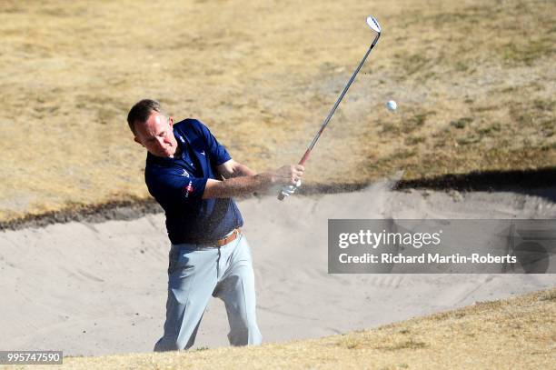 Graeme Lisle of Carlisle Golf Club hits from a bunker on the 18th hole during the Lombard Trophy North of England Qualifier at Sandiway Golf Club on...