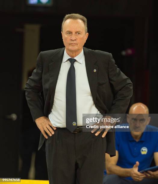 Berlin's head coach Aito Garcia Reneses watches the German Bundesliga basketball game between ratiopharm Ulm and ALBA Berlin at the ratiopharm arena...