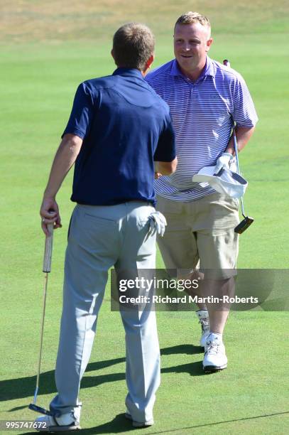 Amateur Gary Robson shakes hands with Graeme Lisle of Carlisle Golf Club on the 18th green during the Lombard Trophy North of England Qualifier at...