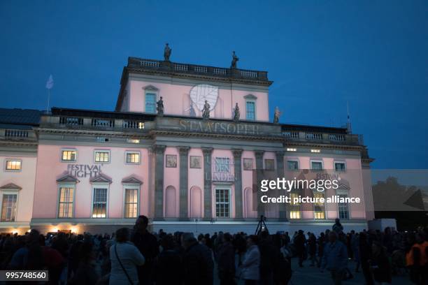 The Staatsoper is illuminated as part of the Festival of Lights in Berlin, Germany, 30 September 2017. Photo: Jörg Carstensen/dpa