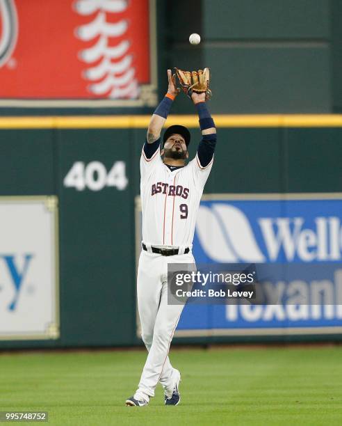 Marwin Gonzalez of the Houston Astros makes a catch on a pop fly by Mark Canha of the Oakland Athletics in the first inning at Minute Maid Park on...