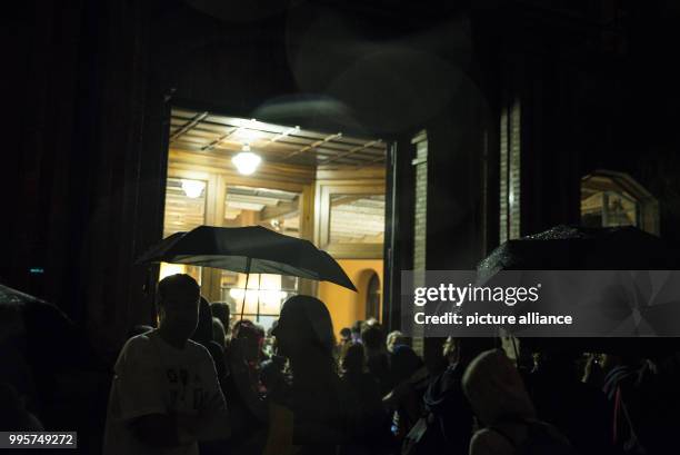 People have gathered outside Escola de Treball school in Barcelona, Spain, in the early houes of 1 October 2017. Hundreds of people have assembled...