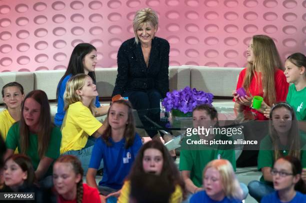 Presenter Carmen Nebel and children on stage during the ZDF TV show "Willkommen bei Carmen Nebel" at the TUI-Arena in Hanover, Germany, 30 September...