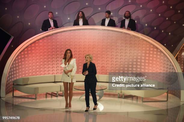 Schlager singer Andrea Berg and presenter Carmen Nebel on stage during the ZDF TV show "Willkommen bei Carmen Nebel" at the TUI-Arena in Hanover,...