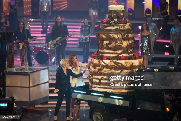 Singer Andrea Berg and presenter Carmen Nebel on stage during the ZDF TV show "Willkommen bei Carmen Nebel" at the TUI-Arena in Hanover, Germany, 30...