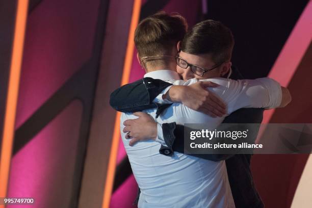 Donor Niklas and donatee Melanie hug on stage during the ZDF TV show "Willkommen bei Carmen Nebel" at the TUI-Arena in Hanover, Germany, 30 September...