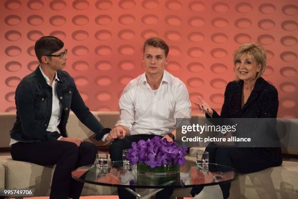 Donatee Melanie , donor Niklas and presenter Carmen Nebel on stage during the ZDF TV show "Willkommen bei Carmen Nebel" at the TUI-Arena in Hanover,...