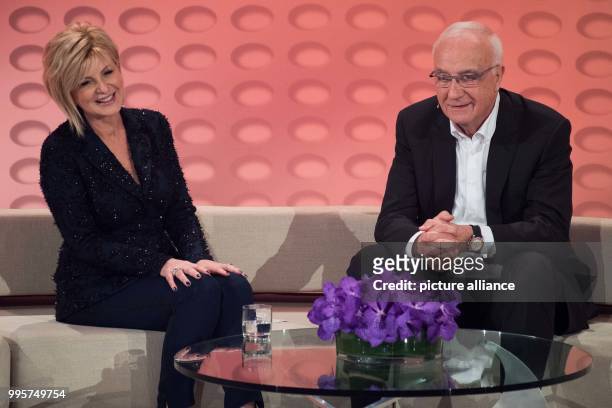 Presenter Carmen Nebel and former WDR director Fritz Pleitgen on stage during the ZDF TV show "Willkommen bei Carmen Nebel" at the TUI-Arena in...