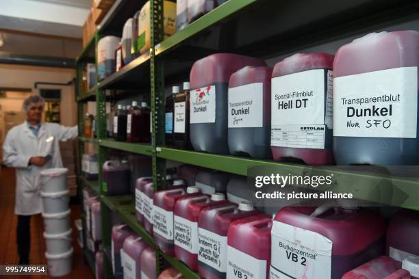 Manager Lorenz Koch standing beside shelves of various types of fake blood at the Kryolan company in Berlin, Germany, 21 September 2017. The Kryolan...