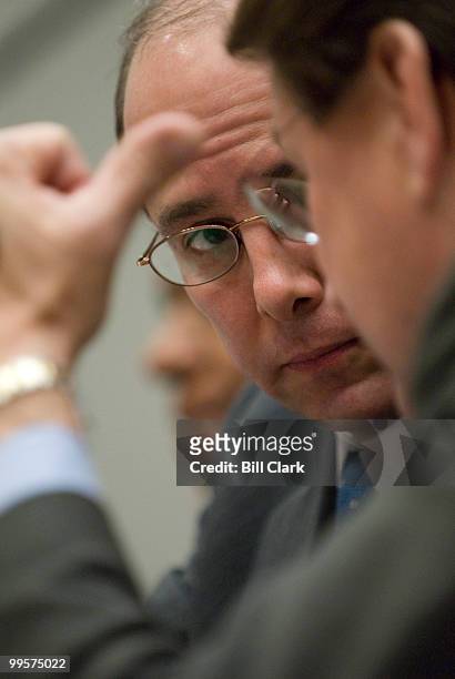 Rep. Charles Boustany, R-La., speaks with Rep. Charlie Melancon, D-La., during the House Financial Services Committee hearing on the federal housing...