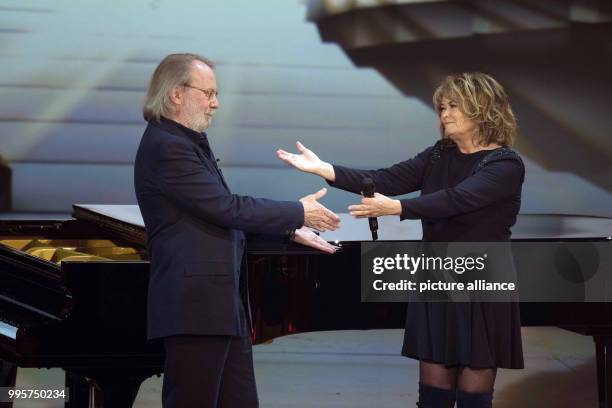 Swedish musician Benny Anderson and schlager singer Wencke Mhyre on stage during the ZDF TV show "Willkommen bei Carmen Nebel" at the TUI-Arena in...