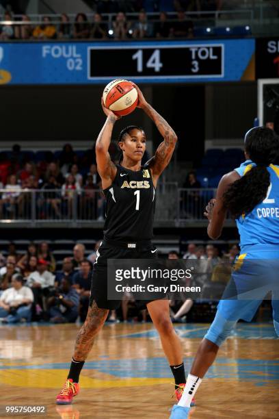 Tamera Young of the Las Vegas Aces handles the ball during the game against Kahleah Copper of the Chicago Sky on July 10, 2018 at the Wintrust Arena...