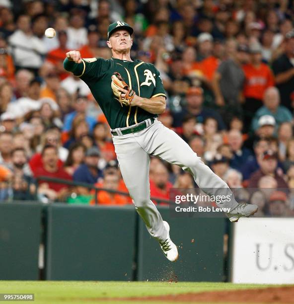 Matt Chapman of the Oakland Athletics throws out Max Stassi of the Houston Astros in the second inning at Minute Maid Park on July 10, 2018 in...